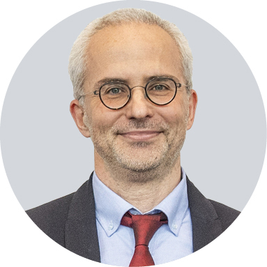 Yiğit Akin smiles for a portrait.