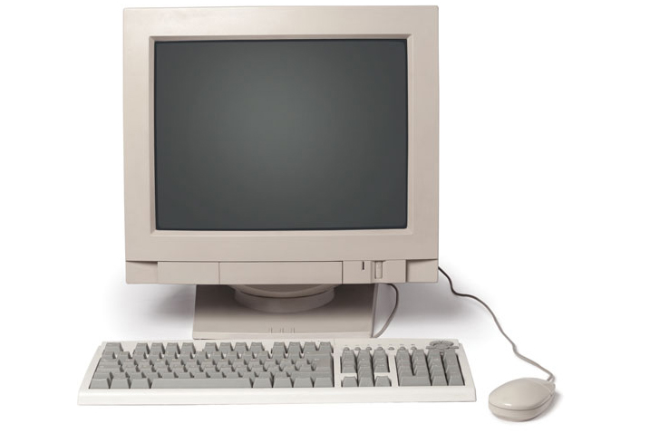 AN old-style PC computer with wire-attached keyboard and mouse