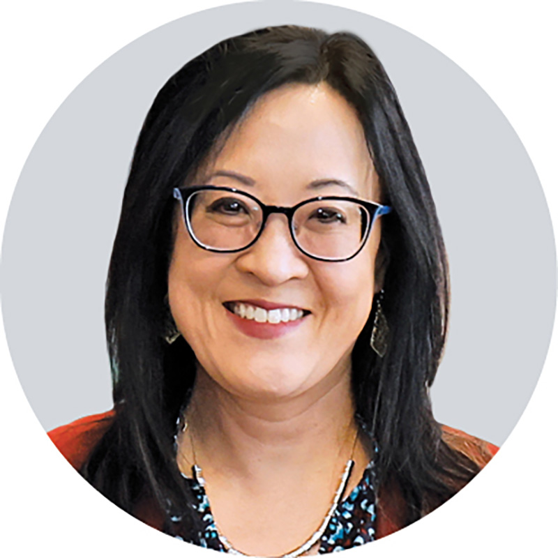 Shirley Yu smiles in this headshot after accepting her award. She's an Asian lady with dark hair and eyes and glasses.