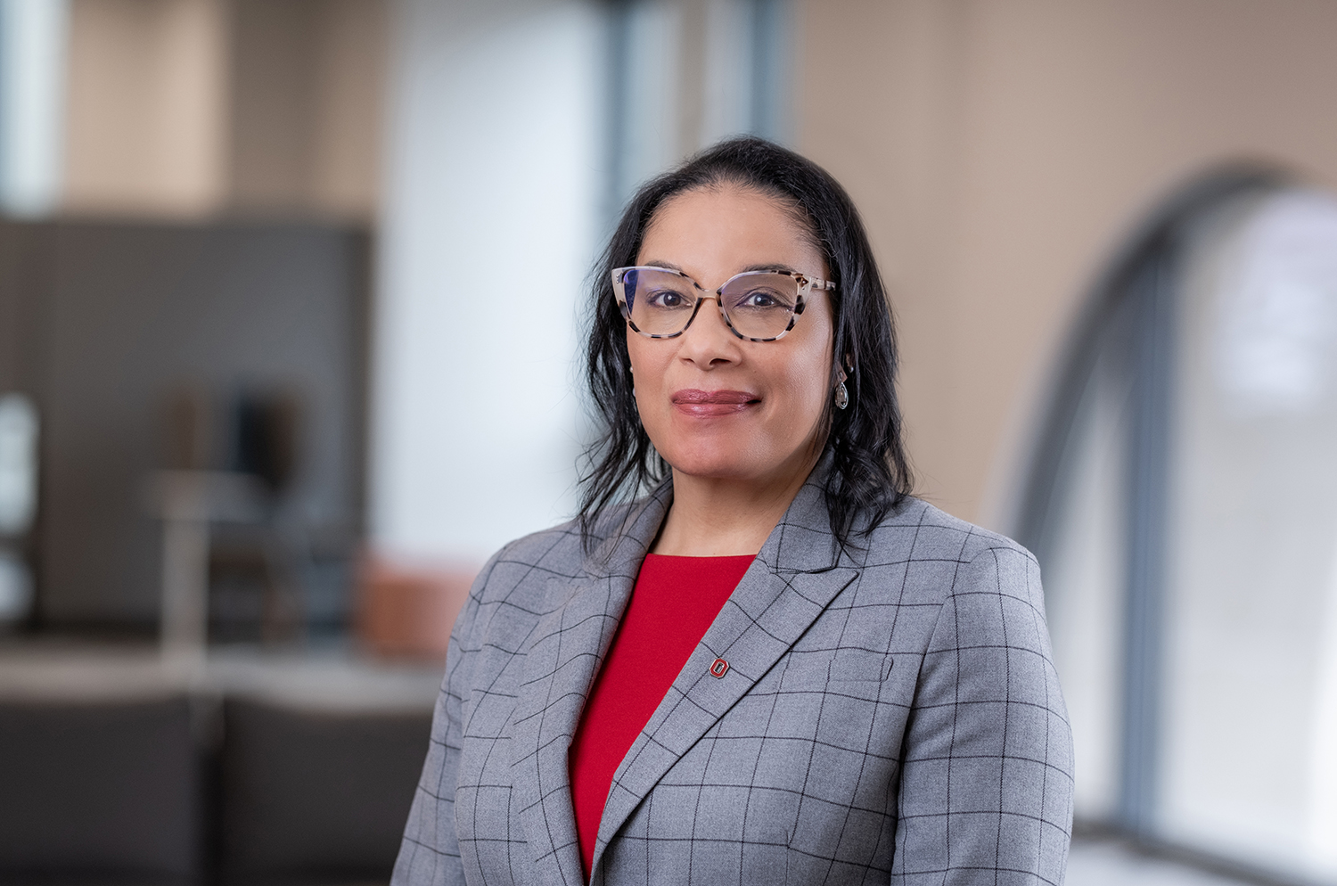 Ange-Marie Hancock is a black woman who seems smart and friendly. She wears tortoise shell glasses, a plaid suit coat and a smile that seems like she's encouraging a person to keep speaking because she's listening.