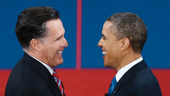 Mitt Romney and Barack Obama are facing each other and smiling in front of a red and blue background during the 2012 presidential election.