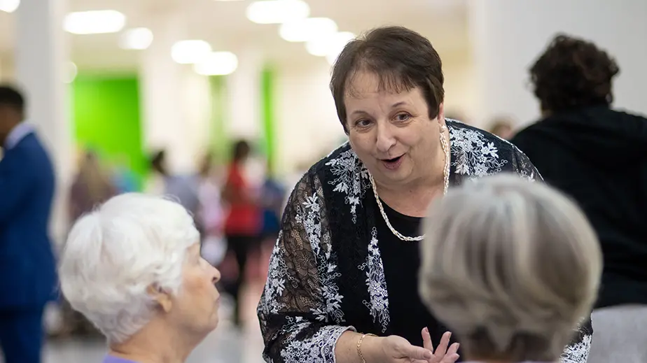 three women conversing