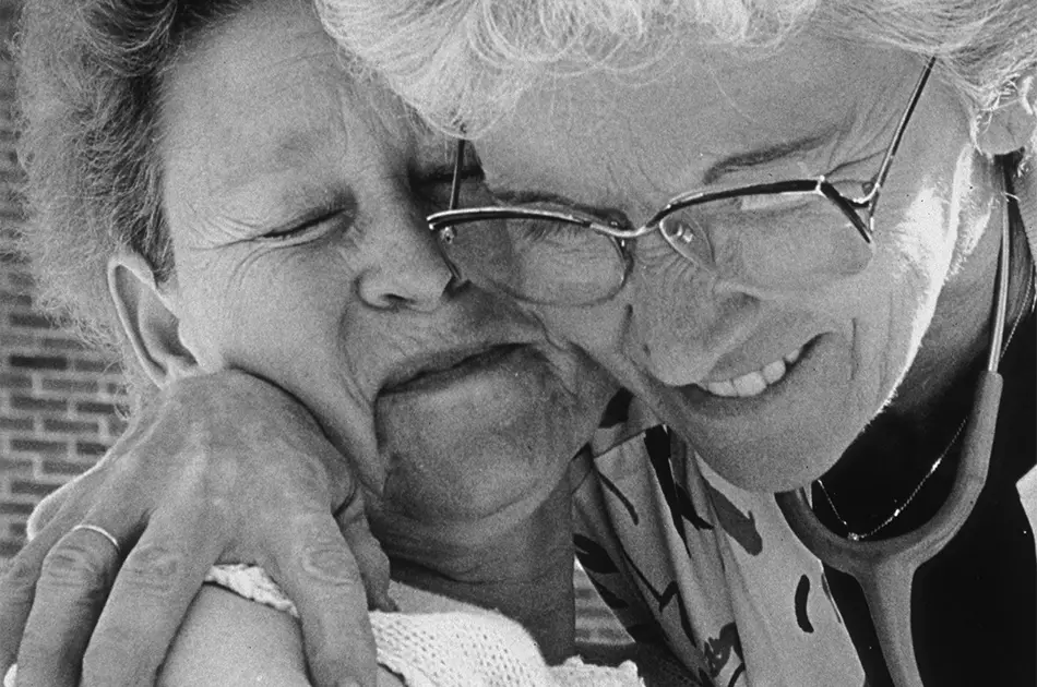 female nurse gives a hug to a patient at the Wexner Medical Center’s James Cancer Hospital