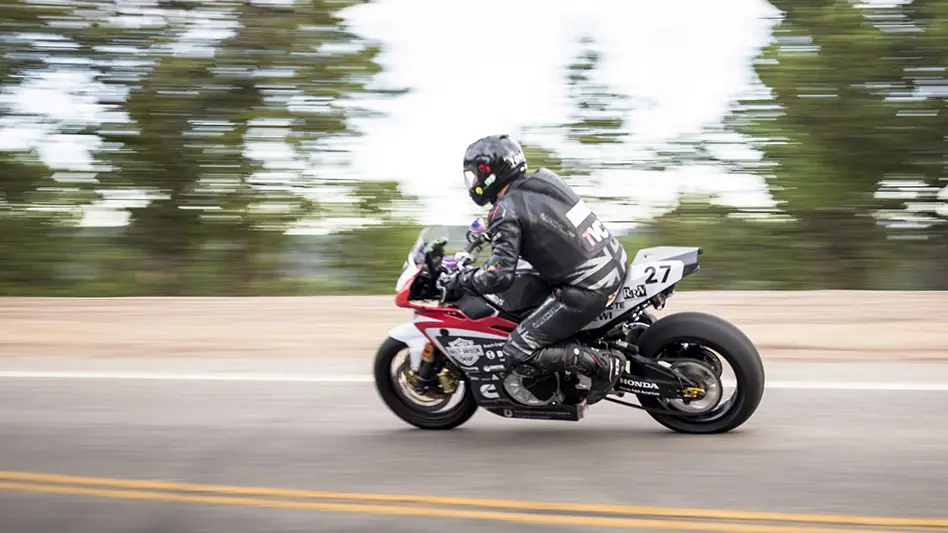 Electric motorcycle driving down the street