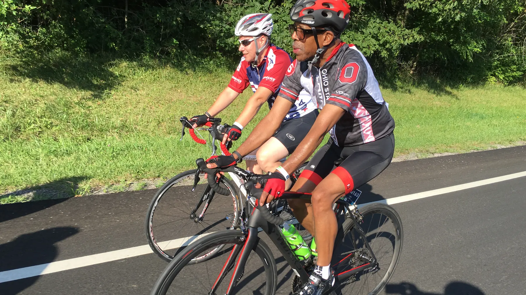 President Drake biking during Pelotonia