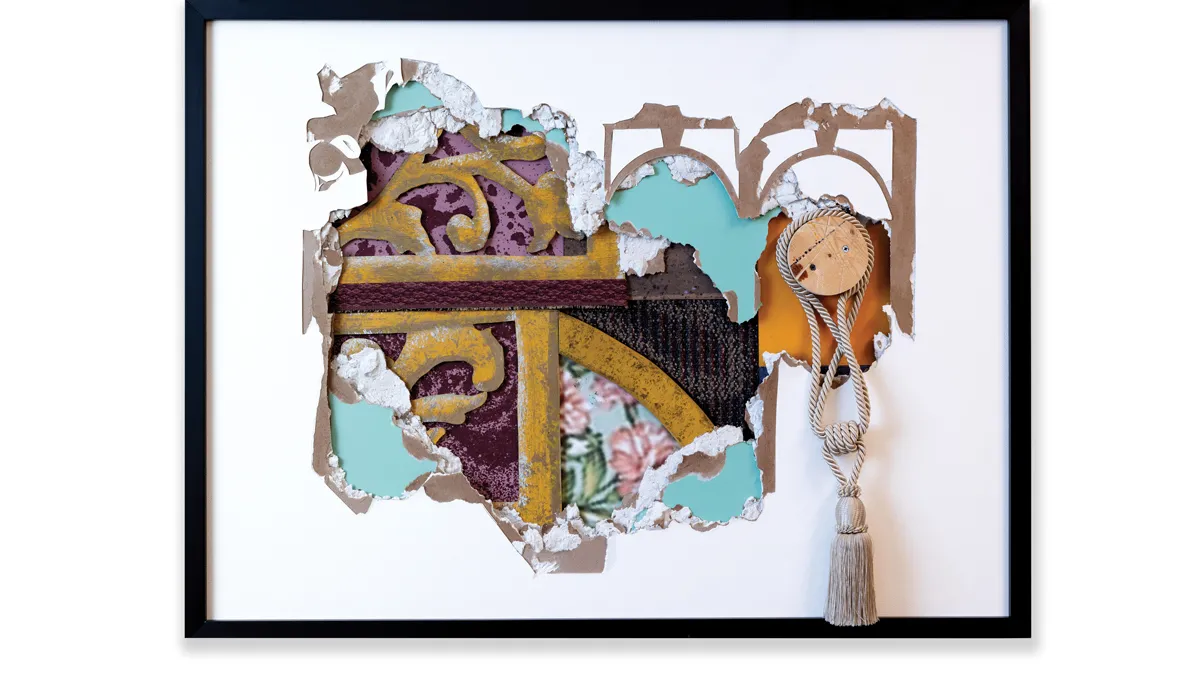 A framed piece of art has a mat with a section torn out of the middle. The missing space shows what is underneath: layers of flat set pieces from a play, including flower-patterned wallpapers, torn mats the color of the sky, and embellishments that form both straight and curved lines.