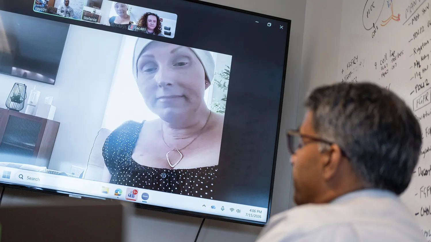 Roychowdhury talks with Stephanie Balm in a video meeting. She wears a scarf wrapped around her head.