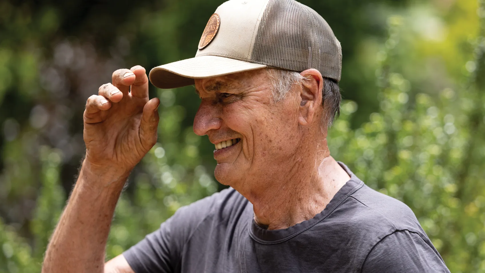 Hutchison laughs as he adjusts his ball cap. His skin is weathered and he wars a T-shirt he will get dirty. He's clearly enjoying himself.