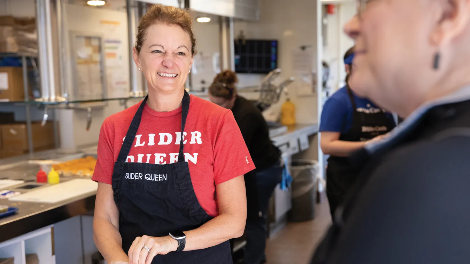 Ingram smiles as she talks with a restaurant employee