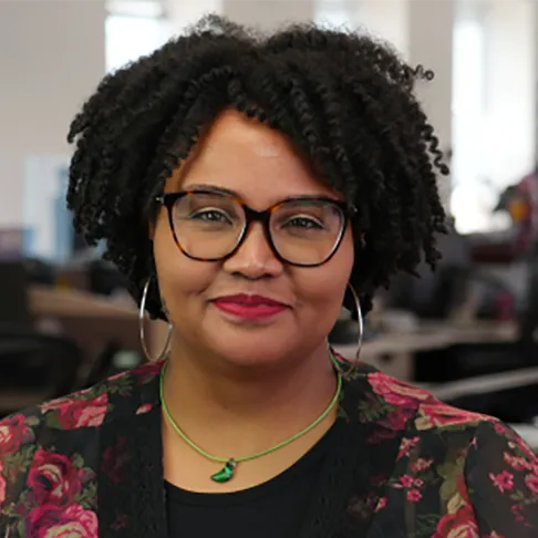 Erica Thompson is a pretty black woman with glasses, cool silver earrings and a close-lipped smile that seems 100% genuine