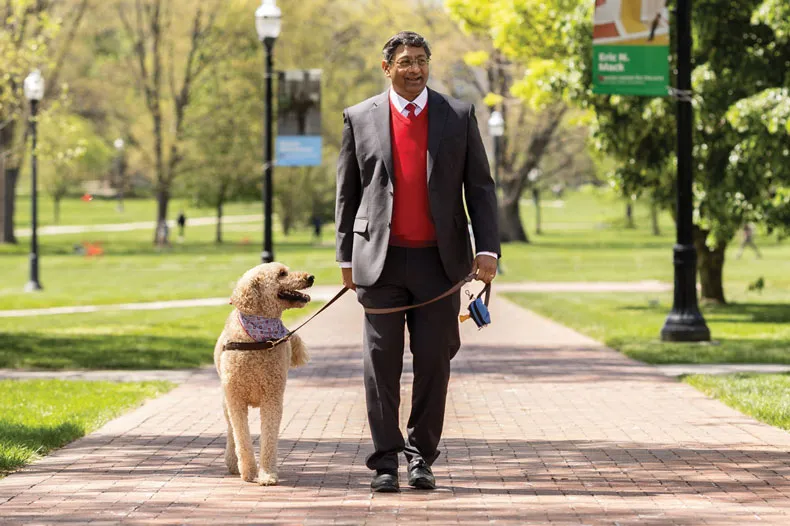 Bellamkonda walks his dog across the Oval