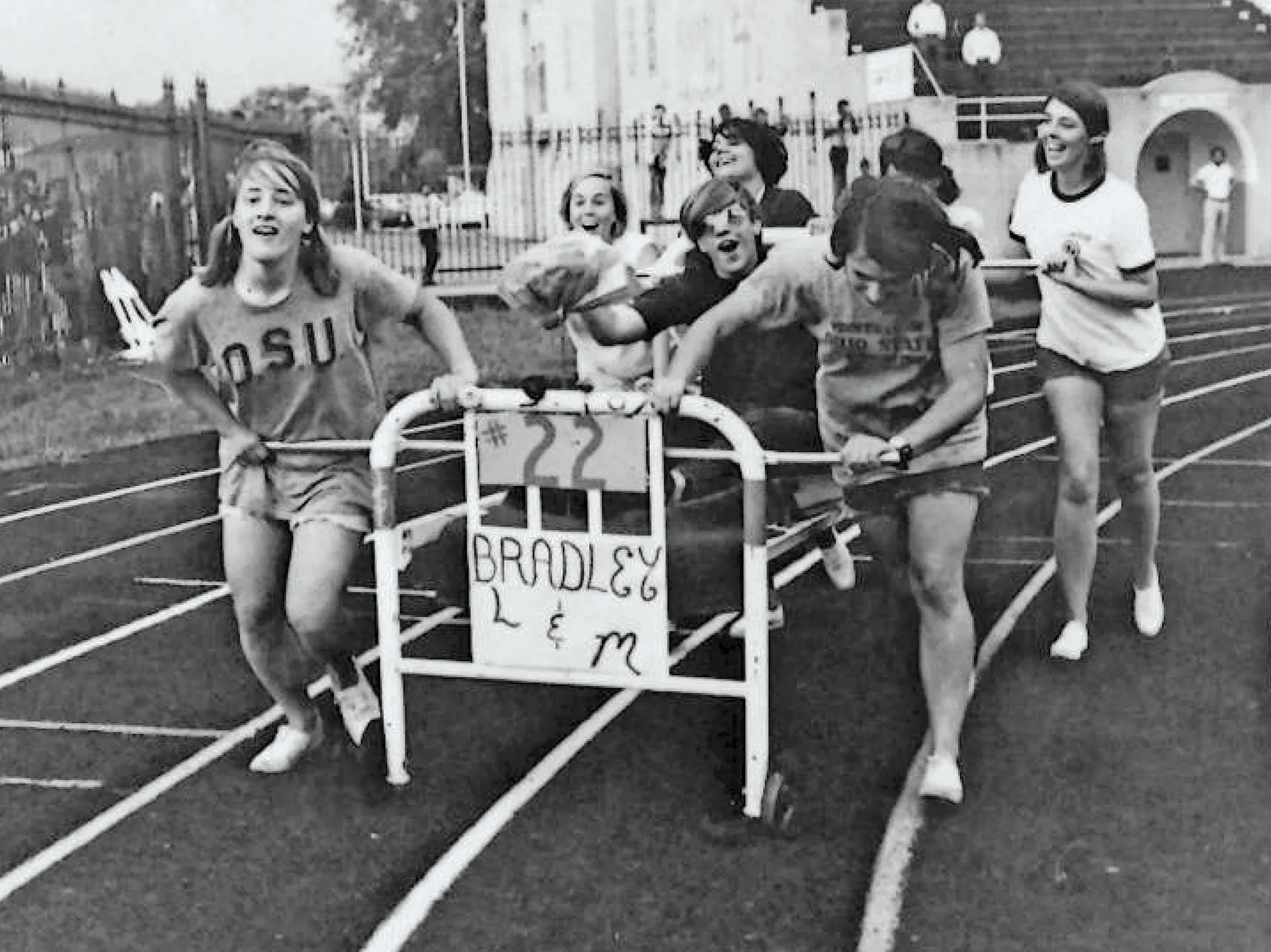 This old black and white photo was taken back in the day, when students push a dorm bed on wheels around the track on the field inside Ohio Stadium.