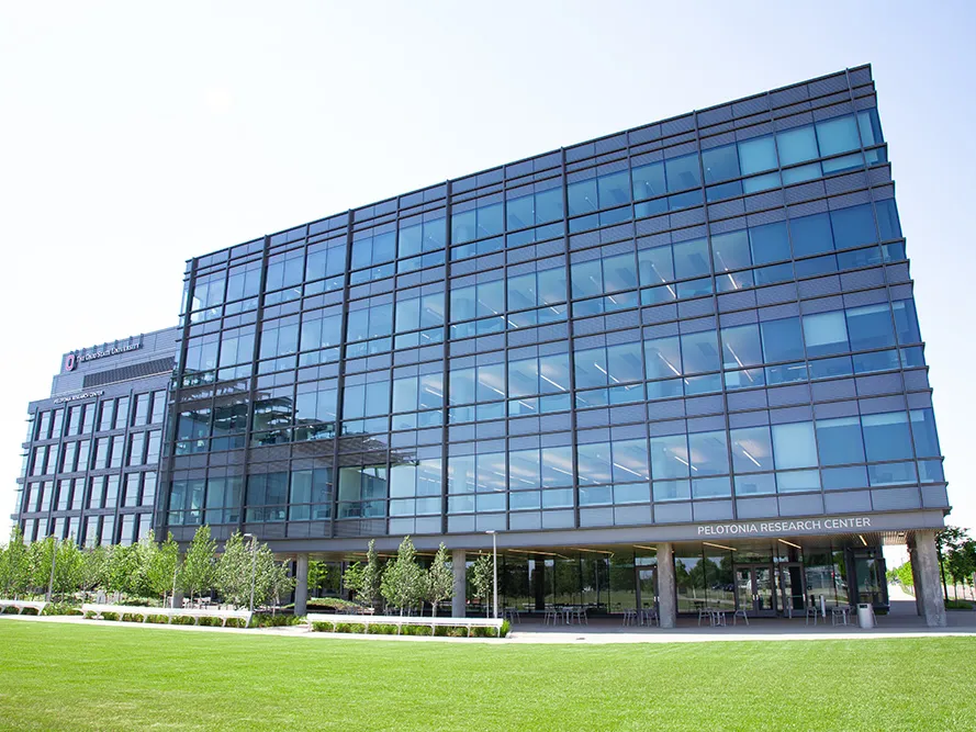 The exterior of the modern Pelotonia Research Building is entirely coated in windows.