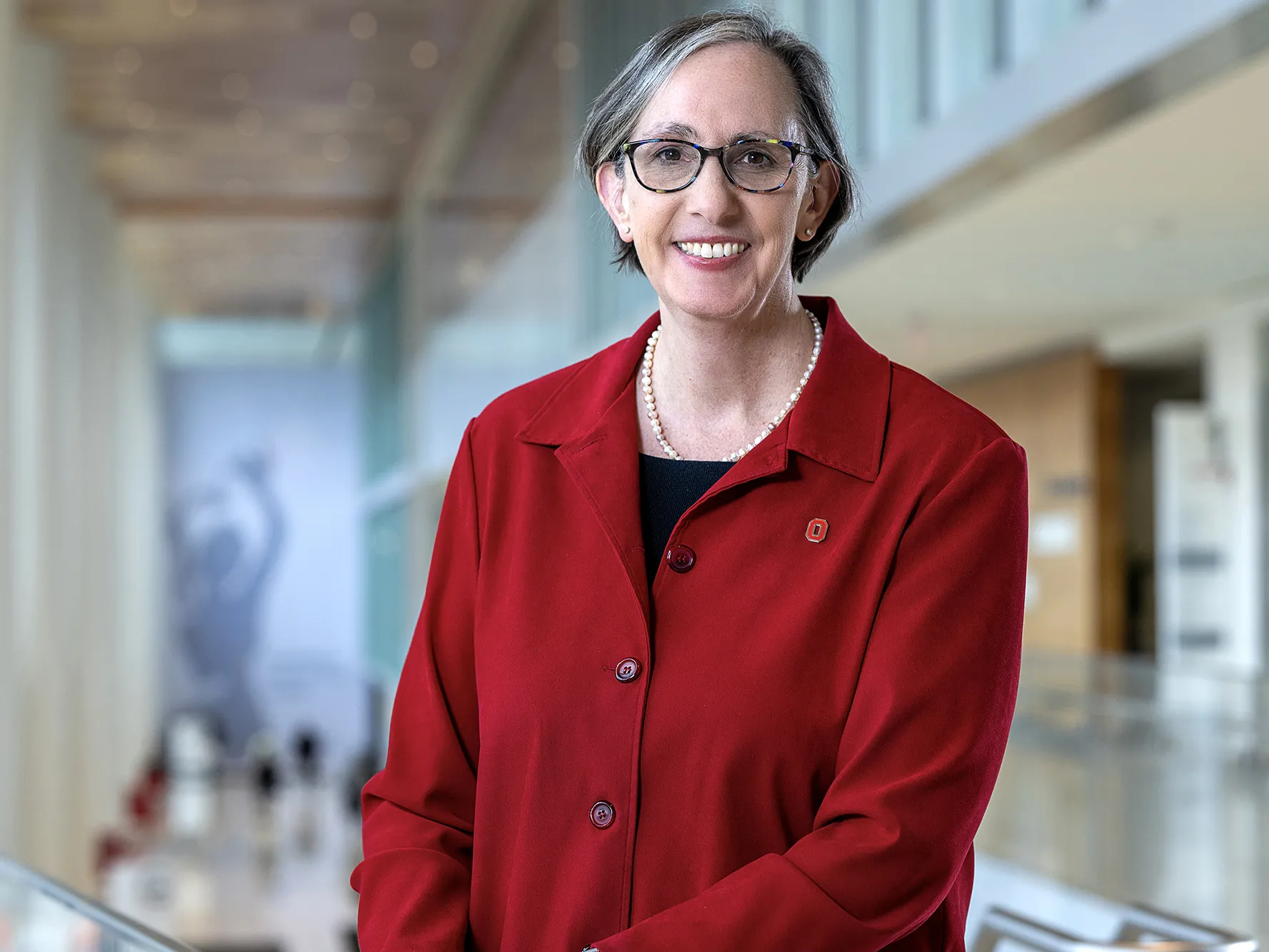 Dr. W. Kimryn Rathmell, the new leader of Ohio State's James Cancer Hospital, poses for this portrait. She is a white woman with hair cut just below chin-length, glasses and a friendly smile.