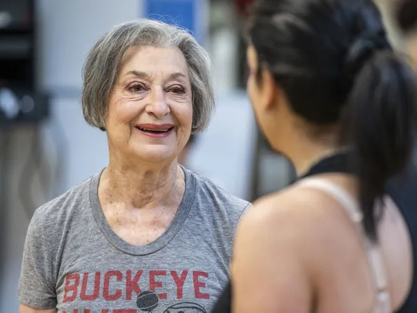 Flo Shleiferman Gurwin talks to a fellow exerciser during a cardio class